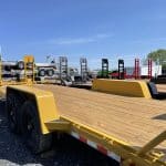 CAT YELLOW LOW PRO EQUIPMENT HAULER TRAILER WITH LADDER RAMPS AND BLACK MOD WHEELS, FRONT STOP RAIL